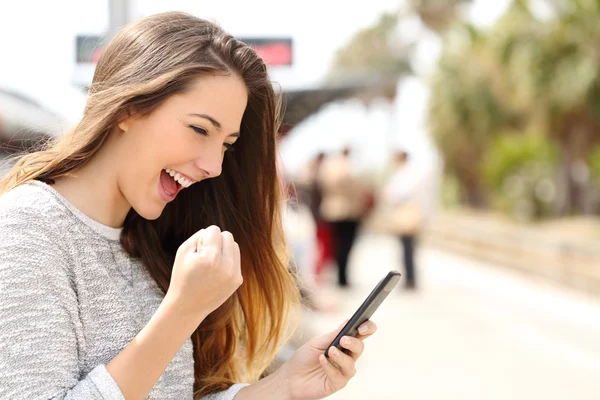 depositphotos_73762623-stock-photo-euphoric-woman-watching-her-smart